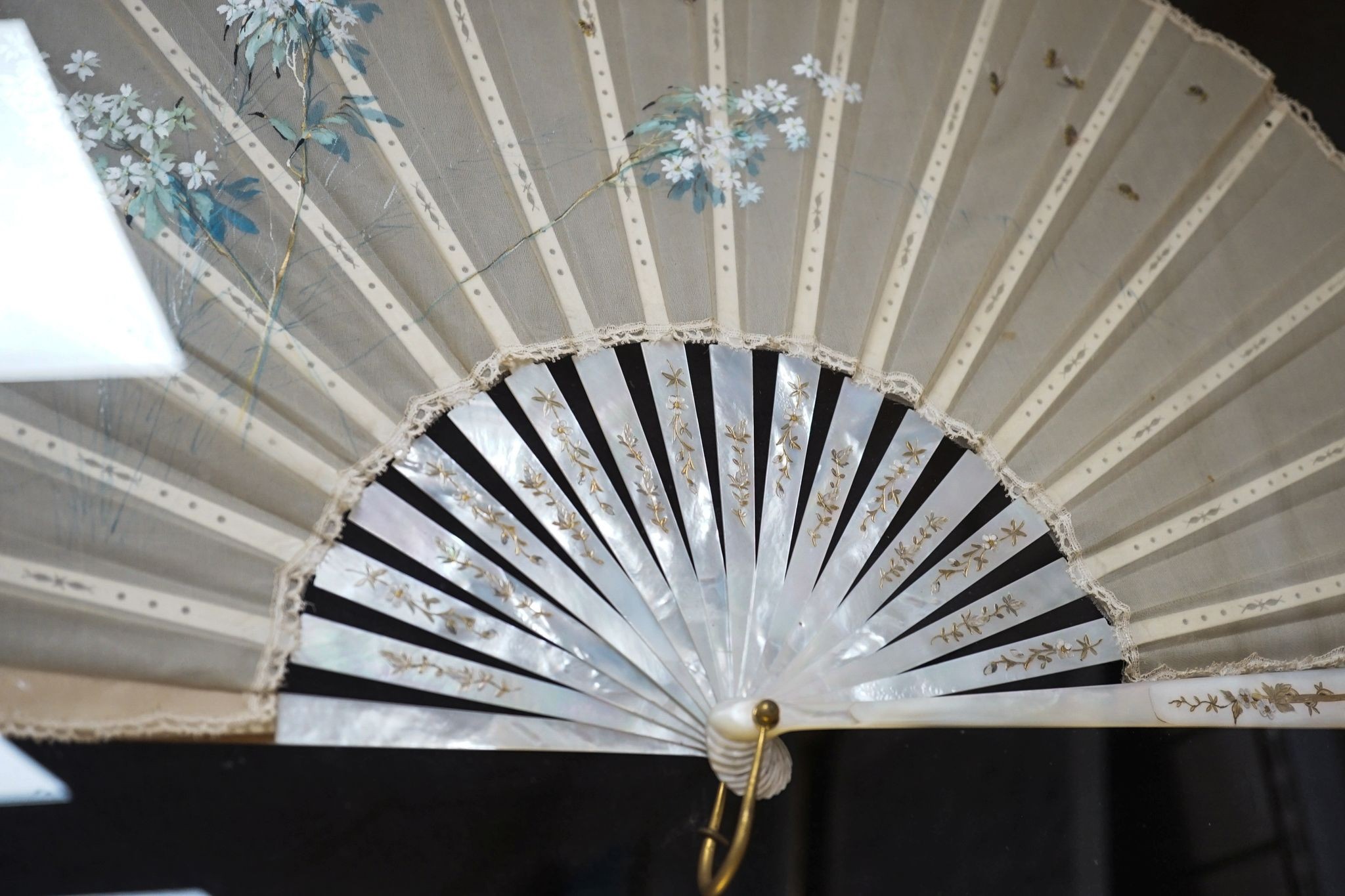 A framed 19th century French mother of pearl and painted silk fan, approx. 60cm long excl frame